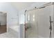 Modern bathroom with glass shower enclosure, soaking tub, and natural light at 9048 River Bend Ct, Villa Rica, GA 30180