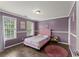 Inviting bedroom featuring stylish decor, hardwood floors, and great natural light at 9048 River Bend Ct, Villa Rica, GA 30180