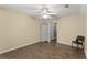 Spacious bedroom with hardwood floors, ceiling fan, and neutral paint at 9048 River Bend Ct, Villa Rica, GA 30180