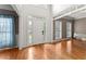 Bright foyer features hardwood floors, neutral paint, and an abundance of natural light at 9048 River Bend Ct, Villa Rica, GA 30180