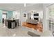 Open-concept living area connecting the kitchen and living room for seamless entertaining and Gathering living at 9048 River Bend Ct, Villa Rica, GA 30180