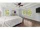 Large bedroom with tray ceilings and large windows to let in the natural light and a view at 9048 River Bend Ct, Villa Rica, GA 30180