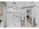 Bright bathroom featuring a glass enclosed shower with mosaic tiles and access to an adjoining bedroom at 162 Daltree Ct, Marietta, GA 30068