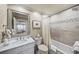Bathroom with marble counter, tiled shower, and view into the main bedroom at 162 Daltree Ct, Marietta, GA 30068