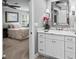 Bathroom featuring a marble countertop vanity, a large mirror, and access to the bedroom at 162 Daltree Ct, Marietta, GA 30068