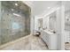 Bright bathroom features a frameless glass shower, dual vanities, and marble countertops at 162 Daltree Ct, Marietta, GA 30068