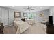 Cozy bedroom featuring neutral tones, two twin beds, a ceiling fan, and natural light from the window at 162 Daltree Ct, Marietta, GA 30068