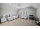 Bright bonus room featuring a vaulted ceiling, a window with natural light, and neutral tones at 162 Daltree Ct, Marietta, GA 30068