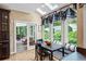 Bright breakfast nook with skylights and a view of the landscaped backyard through large windows at 162 Daltree Ct, Marietta, GA 30068