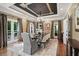 Formal dining room features a stunning chandelier, hardwood floors, and many large windows offering an abundance of natural light at 162 Daltree Ct, Marietta, GA 30068
