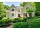 Beautiful two-story brick home with lush landscaping, a welcoming entrance, and lovely architectural details at 162 Daltree Ct, Marietta, GA 30068
