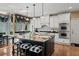 Charming kitchen featuring an island, modern appliances, granite countertops, and a dining area with window seats at 162 Daltree Ct, Marietta, GA 30068
