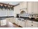 Well-appointed kitchen featuring stainless steel appliances, custom cabinetry, and elegant countertops for cooking at 162 Daltree Ct, Marietta, GA 30068