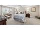 Large bedroom features soft lighting, a ceiling fan, neutral tones, and generous closet space at 162 Daltree Ct, Marietta, GA 30068