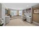 Home office with custom built in shelving, cabinets, and window seating at 162 Daltree Ct, Marietta, GA 30068