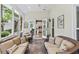 Relaxing screened porch with comfortable seating. A view to the kitchen and dining area offer easy entertaining options at 162 Daltree Ct, Marietta, GA 30068