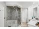 Oversized shower with glass door, marble surround and a rain shower head at 162 Daltree Ct, Marietta, GA 30068
