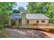 Spacious backyard featuring a deck, screened in porch, lush trees and more! at 2020 Commonwealth Pl, Cumming, GA 30041