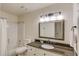 Bathroom with a shower-tub combo, granite countertops, and updated fixtures at 2020 Commonwealth Pl, Cumming, GA 30041