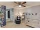 A cute Bedroom featuring a crib, a recliner, and a themed accent wall at 2020 Commonwealth Pl, Cumming, GA 30041