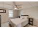 Comfortable bedroom with a ceiling fan, window and full-sized bed at 2020 Commonwealth Pl, Cumming, GA 30041
