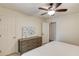 Bedroom featuring plush carpeting, a ceiling fan, and a view to the ensuite at 2020 Commonwealth Pl, Cumming, GA 30041