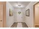 Hallway with hardwood floors, crisp white trim, and neutral walls that provide access to other rooms at 2020 Commonwealth Pl, Cumming, GA 30041