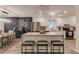 Modern kitchen with an island, granite countertops, and stainless steel appliances blending seamlessly into the dining area at 2020 Commonwealth Pl, Cumming, GA 30041