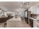 Open-concept kitchen features an island, granite countertops, stainless steel appliances, and a seamless flow with the living area at 2020 Commonwealth Pl, Cumming, GA 30041
