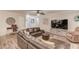 Spacious living room with hardwood floors, a corner entertainment center, and a comfortable seating arrangement at 2020 Commonwealth Pl, Cumming, GA 30041