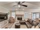 Bright living room featuring a cozy fireplace, hardwood floors, and views of the outdoor entertaining space at 2020 Commonwealth Pl, Cumming, GA 30041