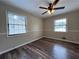 Cozy bedroom featuring natural light and ceiling fan at 2065 Sandgate Cir, Atlanta, GA 30349