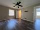 Spacious bedroom with modern ceiling fan, wood-look floors, and closet at 2065 Sandgate Cir, Atlanta, GA 30349