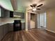 Kitchen featuring laminate flooring and modern appliances at 2065 Sandgate Cir, Atlanta, GA 30349
