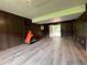 Cozy living room with modern floors, unique fireplace, and wood paneling at 2065 Sandgate Cir, Atlanta, GA 30349
