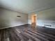 Spacious living room featuring new flooring at 2065 Sandgate Cir, Atlanta, GA 30349