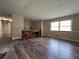 Bright living room with new flooring and large window at 2065 Sandgate Cir, Atlanta, GA 30349