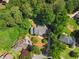A gorgeous property with a gray roof and lush green surroundings in a quiet neighborhood at 2595 Winthrope Way, Lawrenceville, GA 30044