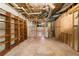 Unfinished basement with exposed ceiling, offering potential for customization at 2595 Winthrope Way, Lawrenceville, GA 30044
