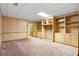 Unfinished basement area with built-in shelving and cabinets at 2595 Winthrope Way, Lawrenceville, GA 30044