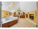 Well-lit bathroom offers large tub, multiple vanities, and tile flooring at 2595 Winthrope Way, Lawrenceville, GA 30044