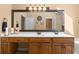 Bathroom features a double vanity, large mirror, and wood cabinetry at 2595 Winthrope Way, Lawrenceville, GA 30044