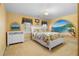 Bright bedroom featuring a mural, white furniture, and a comfortable bed with floral bedding at 2595 Winthrope Way, Lawrenceville, GA 30044