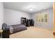 Neutral bedroom featuring a comfortable bed, natural light, and a dedicated workspace at 2595 Winthrope Way, Lawrenceville, GA 30044