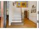 Elegant foyer with a staircase, hardwood floors, and tasteful decor creating a welcoming ambiance at 2595 Winthrope Way, Lawrenceville, GA 30044