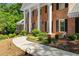 Charming home featuring a pathway, manicured landscaping, and well-maintained lawn at 2595 Winthrope Way, Lawrenceville, GA 30044