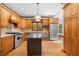Well-lit kitchen with stainless steel appliances, granite countertops, and custom wood cabinetry at 2595 Winthrope Way, Lawrenceville, GA 30044