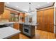 Modern kitchen features stainless steel appliances, granite countertops, and wooden cabinets at 2595 Winthrope Way, Lawrenceville, GA 30044