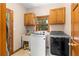 Functional laundry room with modern washer, dryer, and ample cabinet storage at 2595 Winthrope Way, Lawrenceville, GA 30044