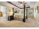 Spacious bedroom with a four-poster bed, tray ceiling, and abundant natural light at 2595 Winthrope Way, Lawrenceville, GA 30044